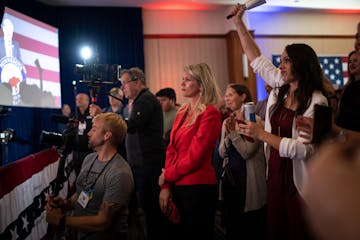 Leslie Larson, in red, was emotional as Republican candidate Scott Jensen spoke without conceding to Gov. Tim Walz at the GOP election night party Tue