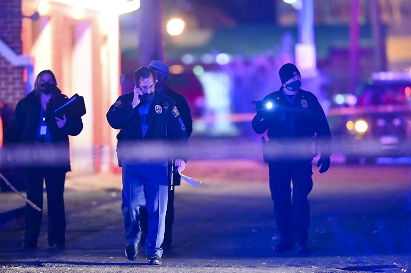 Saint Paul Police officers and Bureau of Criminal Apprehension (BCA) investigators walked near the scene of an earlier shooting in which Saint Paul Police shot a person near Rice Street and Magnolia.