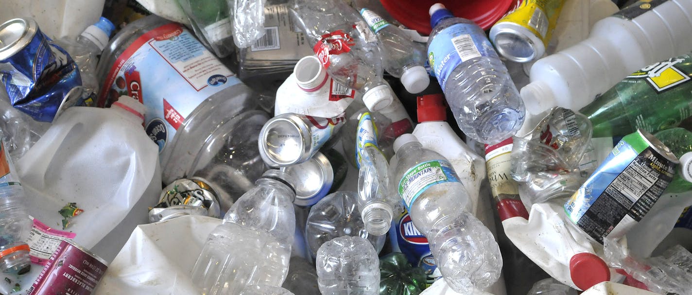 GLEN STUBBE &#x2022; gstubbe@startribune.com -- Tuesday, July 29, 2008 -- Delano, Minn. -- ] At Randy's Sanitation and Recycling of Delano, customers separate recyclables in two streams, one paper, the other glass, cans and plastic, shown here, which is sorted here at their transfer station. ORG XMIT: MIN2014011320104956