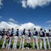 Twins players lined up for the National Anthem before the start of Saturday afternoon's game against the Boston Red Sox.