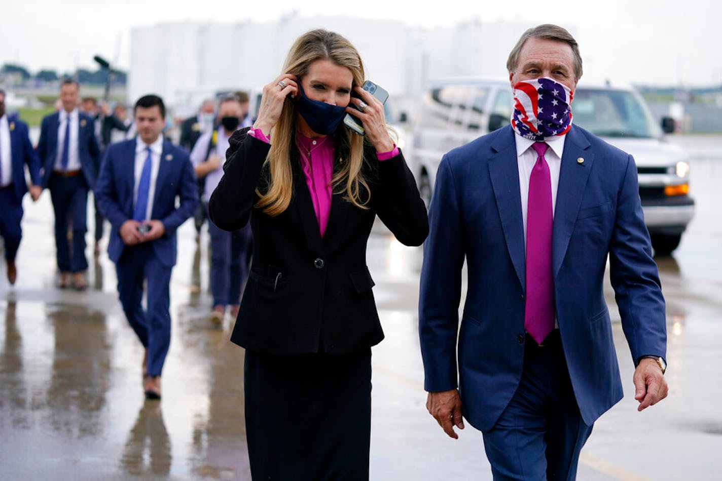 Sen. Kelly Loeffler, R-Ga., and Sen. David Perdue, R-Ga., at UPS Hapeville Airport Hub in Atlanta on July 15, 2020.