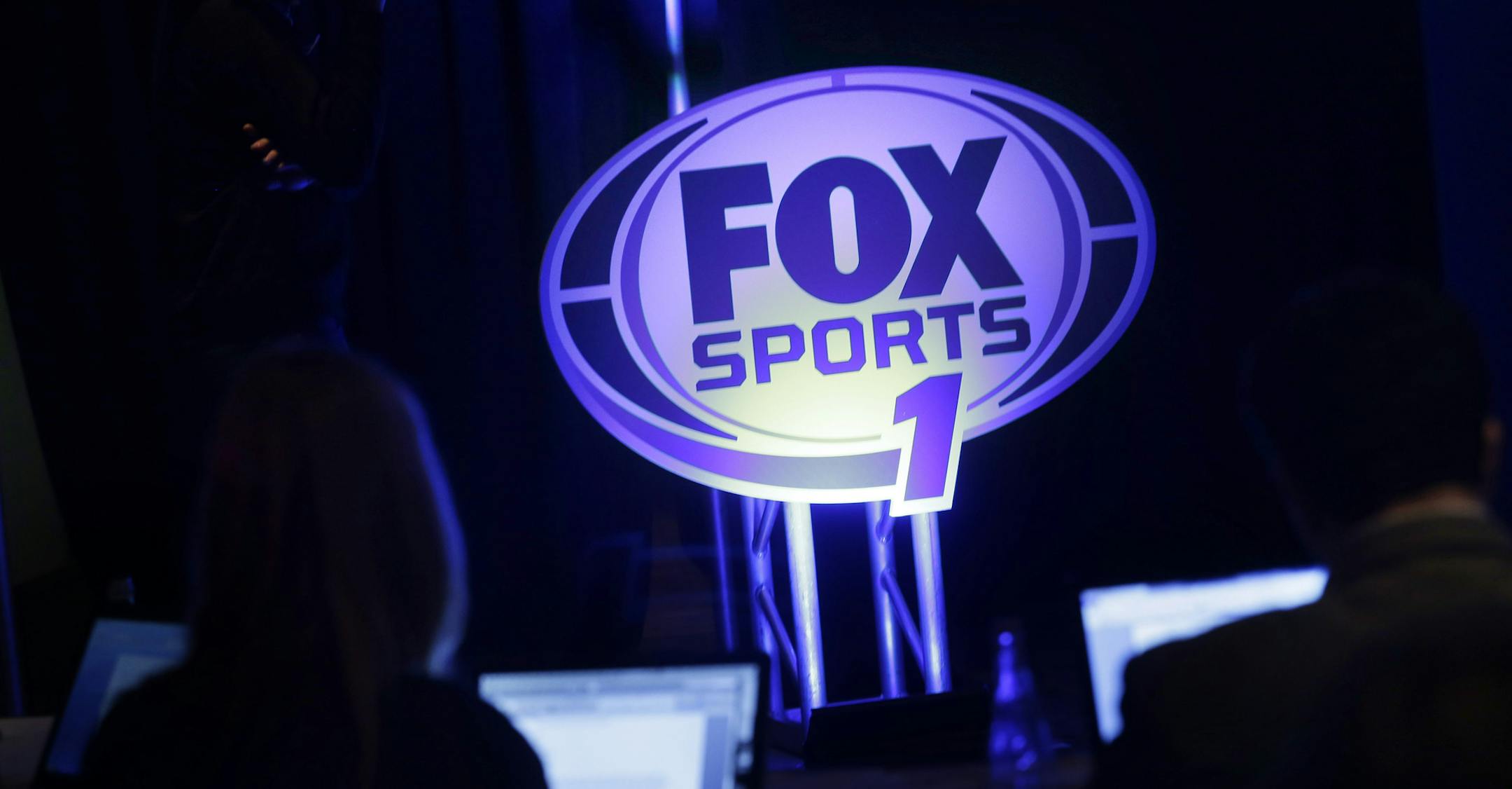 A logo for the new Fox Sports 1 channel is displayed during a news conference in New York, Tuesday, March 5, 2013. Fox says its new sports cable network will launch Aug. 17. (AP Photo/Seth Wenig)