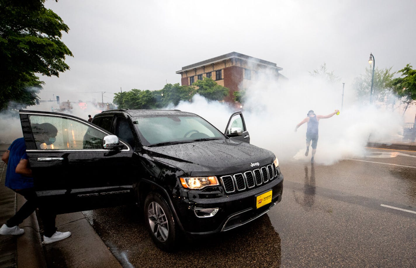 A vehicle was hit by chemical irritant Tuesday night near the 3rd Precinct station as police and protesters clashed after the death of George Floyd while in police custody.