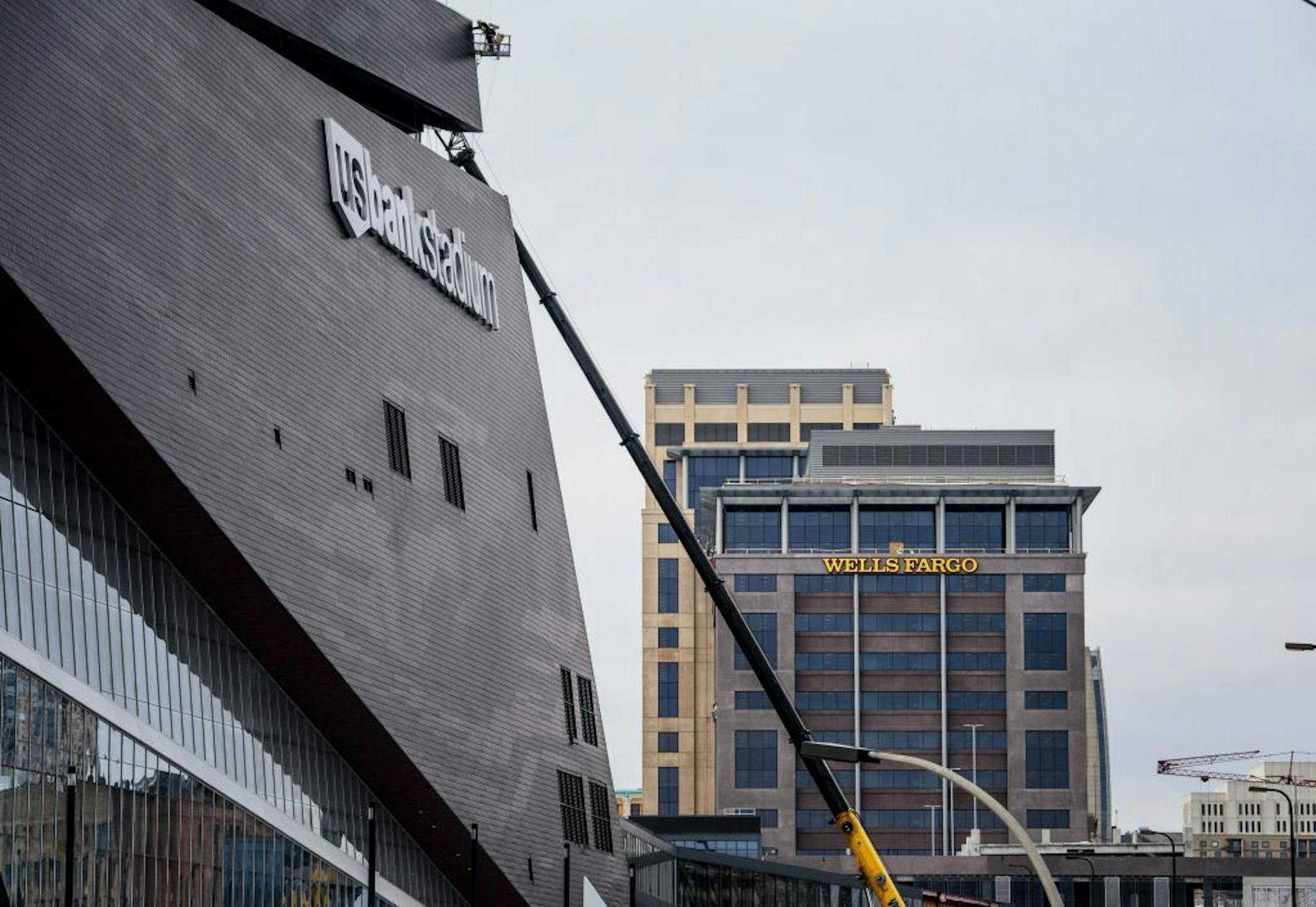The Vikings say the Wells Fargo logos, visible only from above the buildings, "photo bomb" the image of the team's new downtown Minneapolis stadium in telecasts.