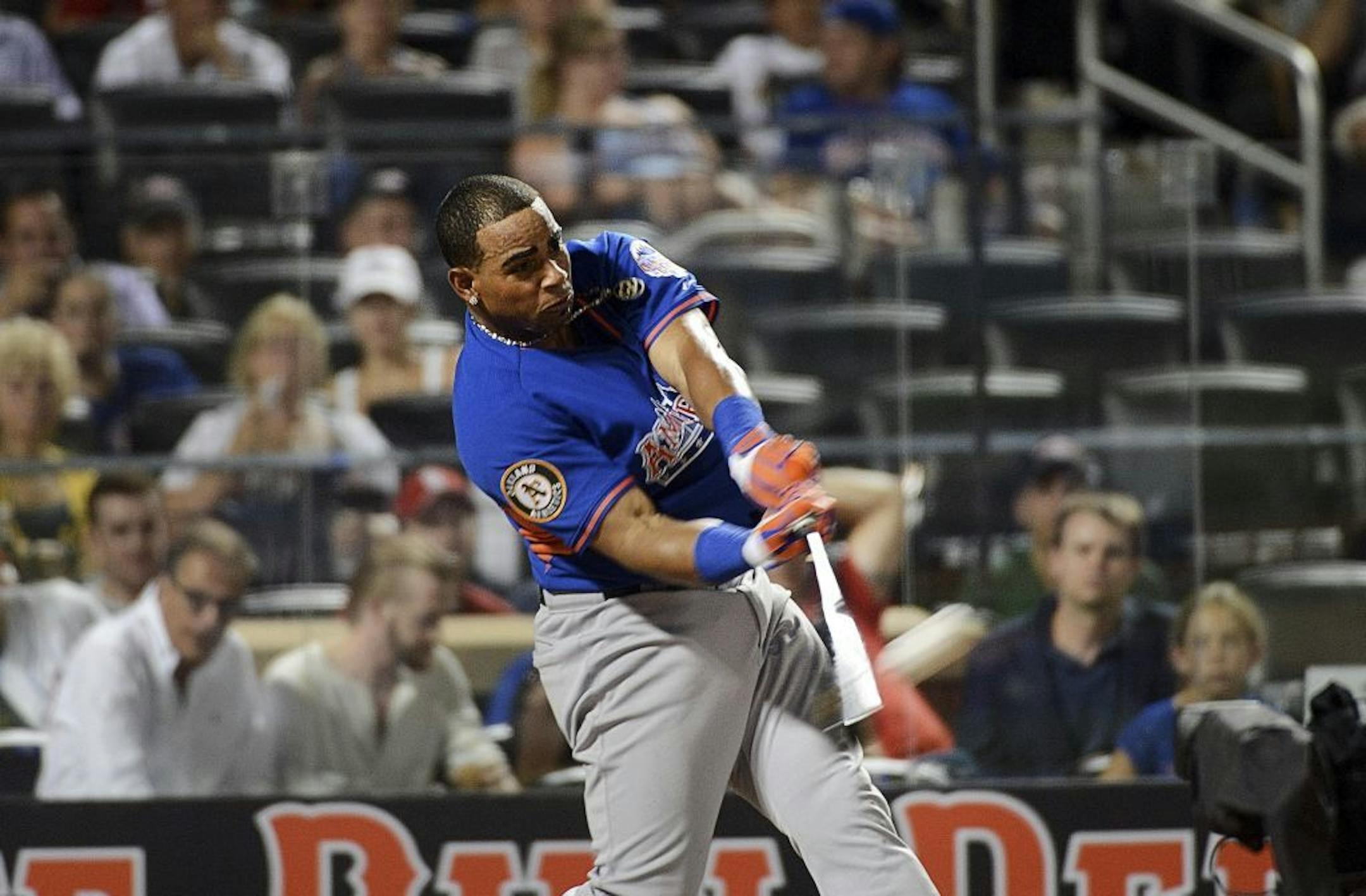Yoenis Cespedes of the Oakland Athletics hits in the final round of the Home Run Derby at Citi Field in New York, July 15, 2013. Cespedes beat Bryce Harper of the Washington Nationals in the final round to win the derby.