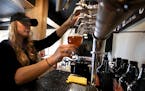 Tap room manager Carissa Darcy poured a beer, while attendant Ted Jedlicki looked on at the LTS Brewing tap room in Rochester. ] JIM GEHRZ &#xef; jame