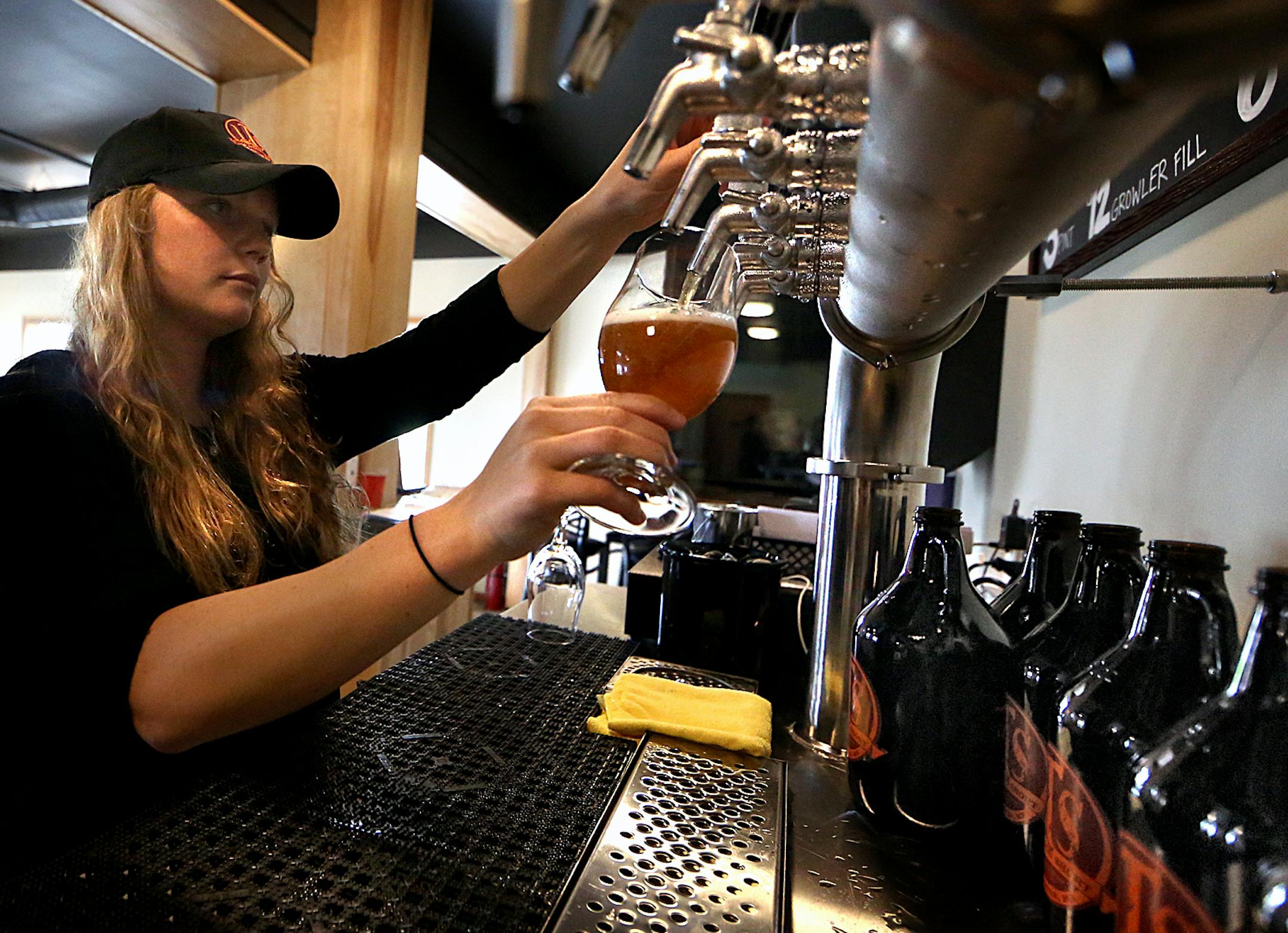 Tap room manager Carissa Darcy poured a beer, while attendant Ted Jedlicki looked on at the LTS Brewing tap room in Rochester. ] JIM GEHRZ ï james.gehrz@startribune.com / Rochester, MN / September 17, 2015 / 3:30 PM BACKGROUND INFORMATION: Rochester's growing number of taprooms scored a win when the City Council tweaked an ordinance, allowing them to sell growlers until 10 p.m. on weeknights. Previously, all liquor and beer sales in the city ended at 8 p.m. But then the city clerk said neve