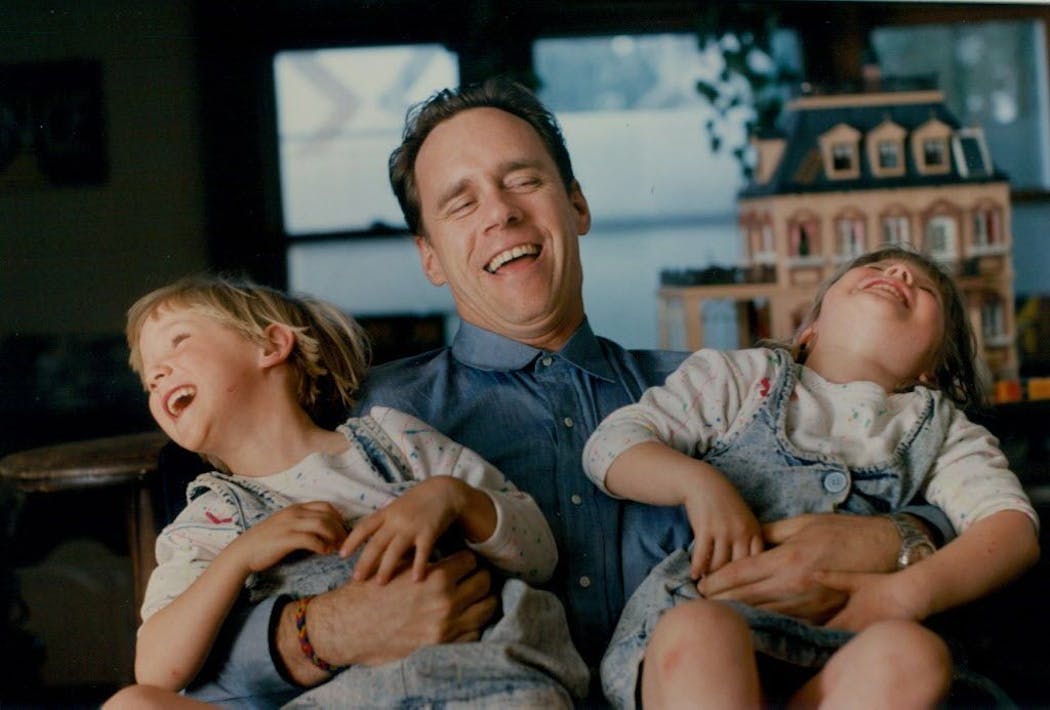 David Carr with his daughters Meagan (left) and Erin (right), both 5 years at the time.