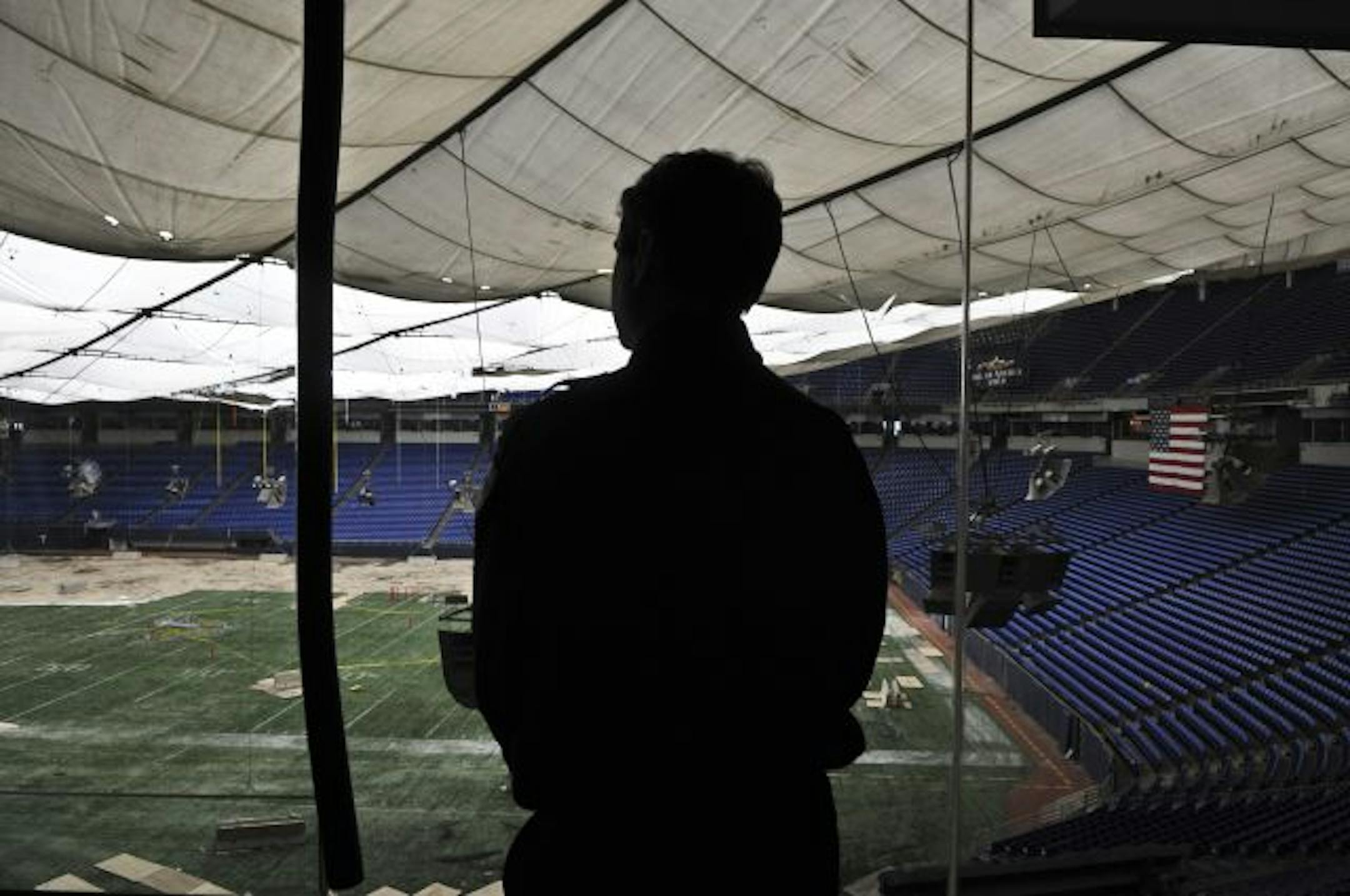 Richard Sennott/Star Tribune. Richard.Sennott@startribune.com Minneapolis Mn. Thursday 2/24/11 Jeff Knutson Who is a security guard at the The Hubert H. Humphrey Metrodome looks out over the field from suite 106B.