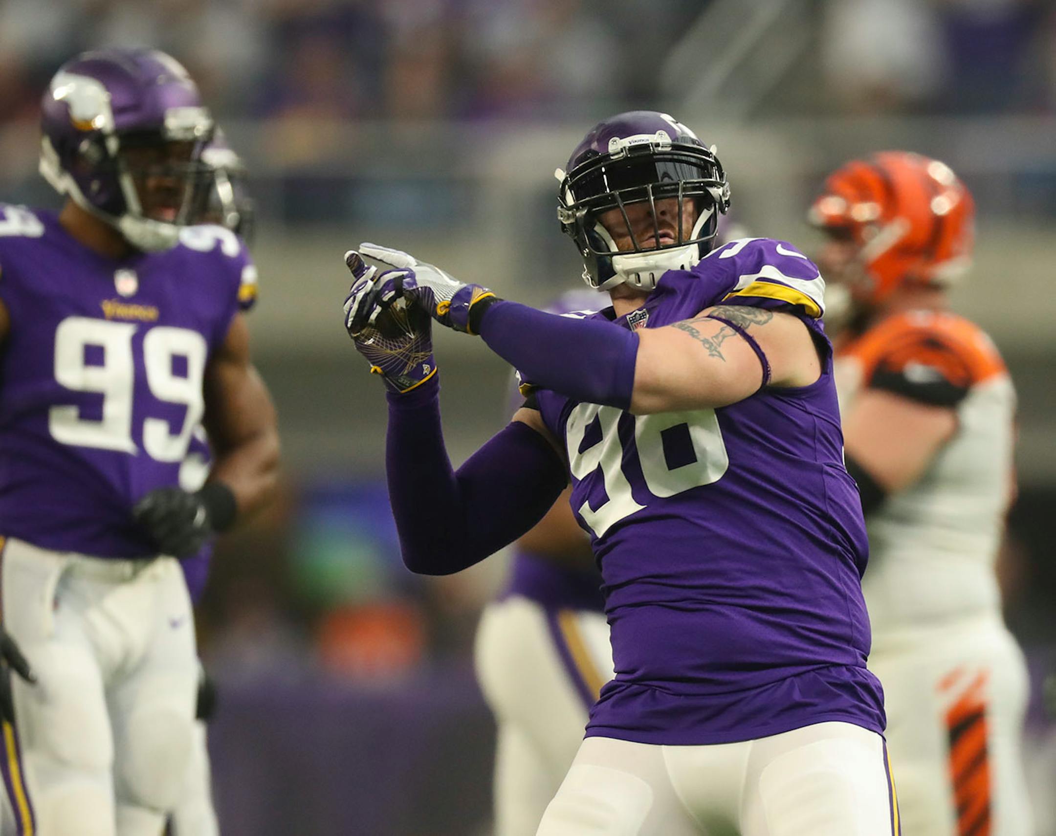 Minnesota Vikings defensive end Brian Robison (96) celebrated his sack of Bengals quarterback Andy Dalton for a six yard loss.
