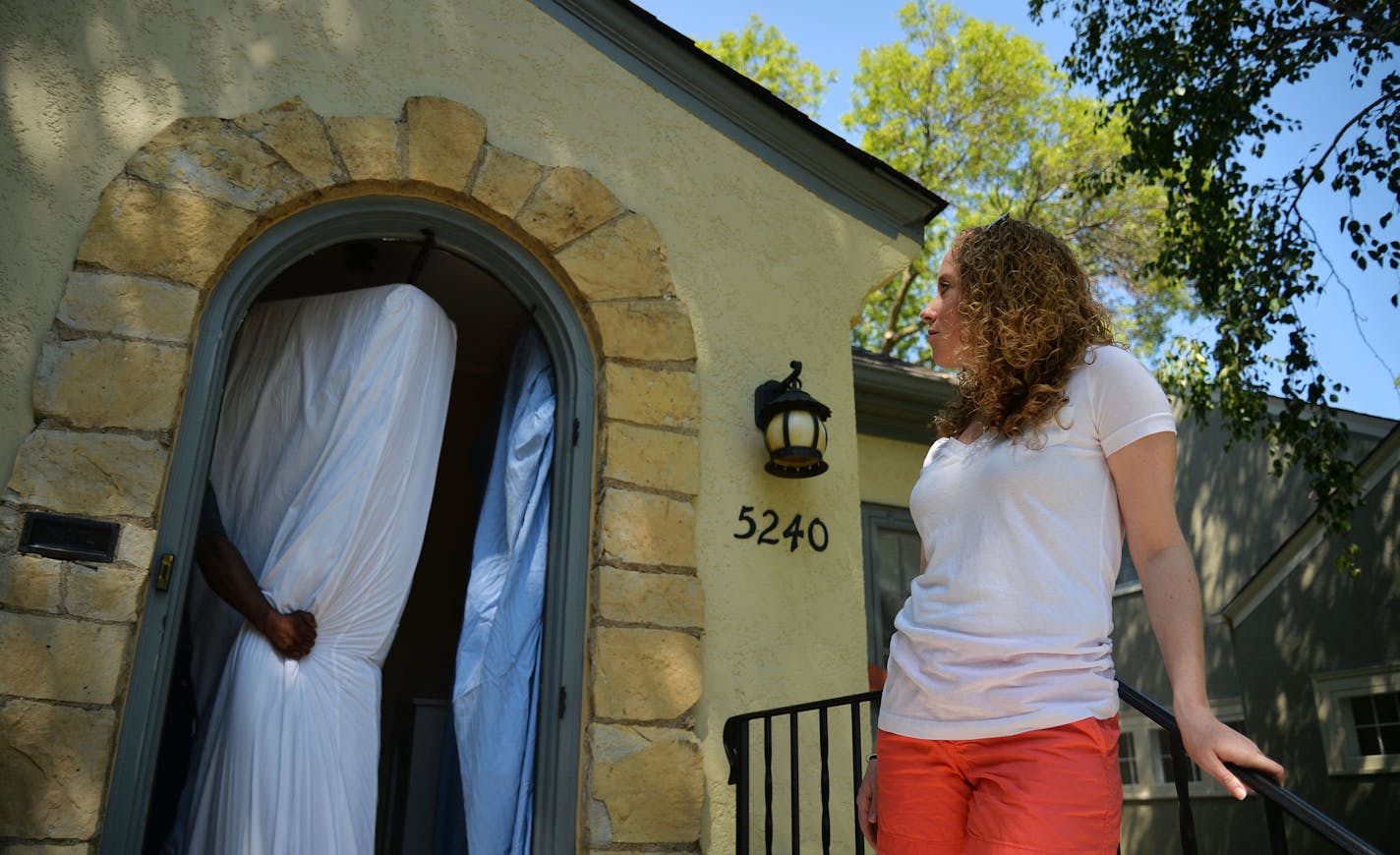 Jennifer Burke watched movers bring furniture into her new home. Jennifer and Brian Burke, first-time buyers, moved into their house in Minneapolis in July.