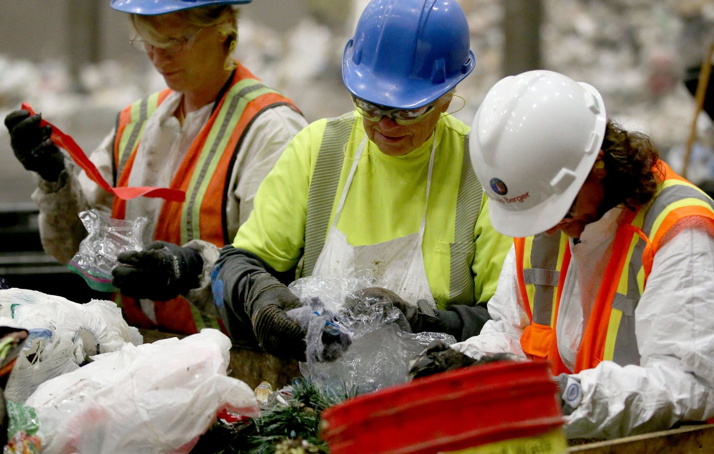 Waste sorters, who are contracted by the county, sift through trash to check the contents during a week-long study at the Hennepin Energy Recovery Center (HERC) May, 12, 2016, in Minneapolis, MN.](DAVID JOLES/STARTRIBUNE)djoles@startribune Hennepin County is digging into residents garbage to learn more about what they are throwing away and what opportunities we are missing to recycle more. The study involves sorting trash into new categories that will provide better, more specific information ab