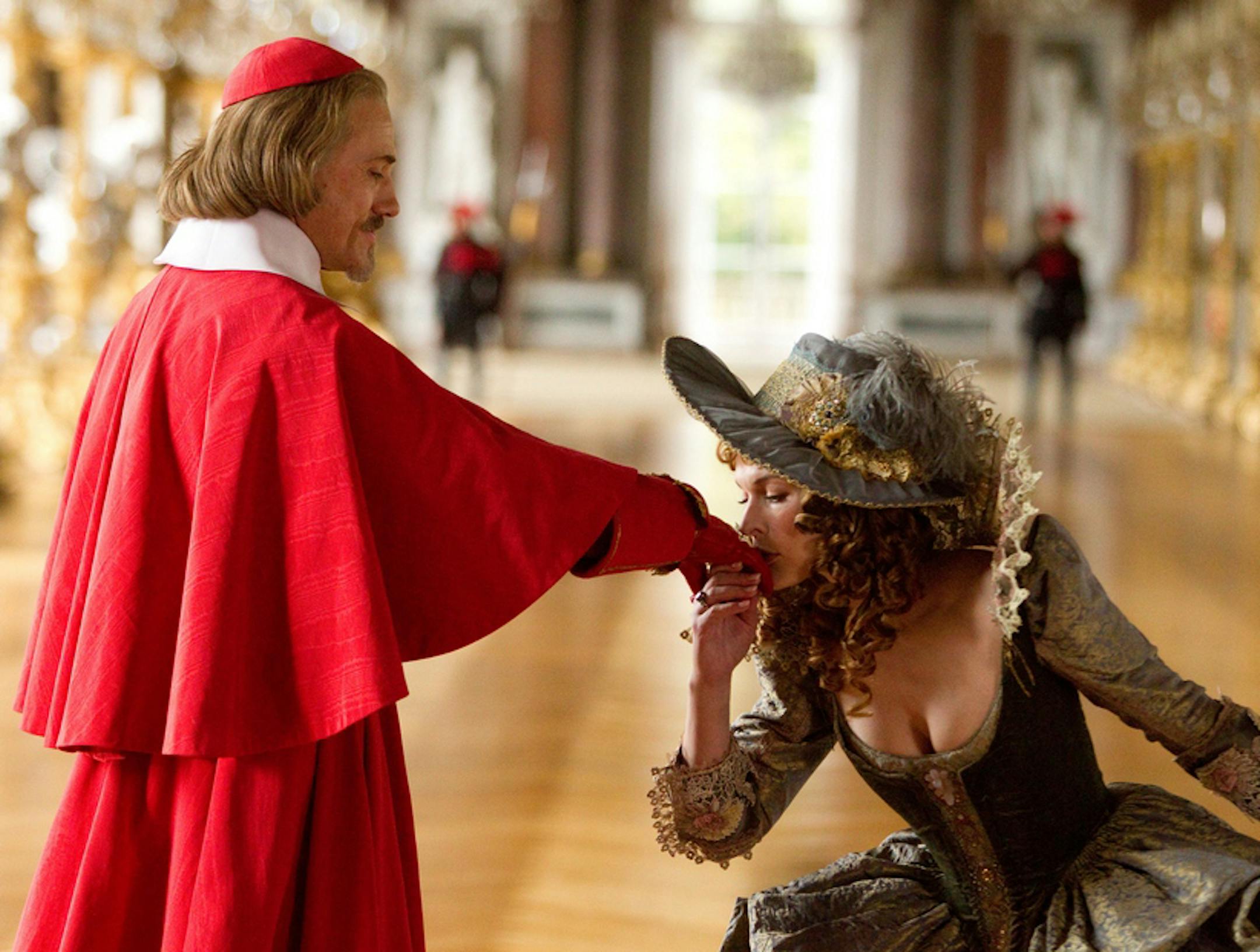 Photo: Rolf Konow, SMPSP Christoph Waltz and and Milla Jovovich star in "The Three Musketeers."