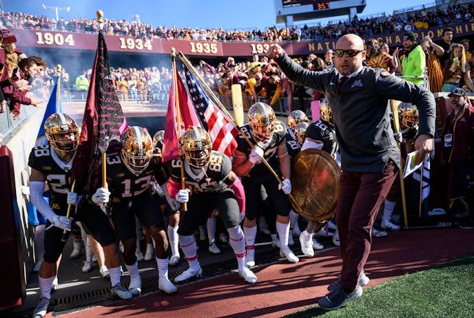 Minnesota Gophers head coach PJ Fleck leads the team onto the field before the start of a football game between the University of Minnesota Gophers and the Maryland Terrapins Saturday, Oct. 23, 2021 at Huntington Bank Stadium in Minneapolis, Minn. ] AARON LAVINSKY • aaron.lavinsky@startribune.com