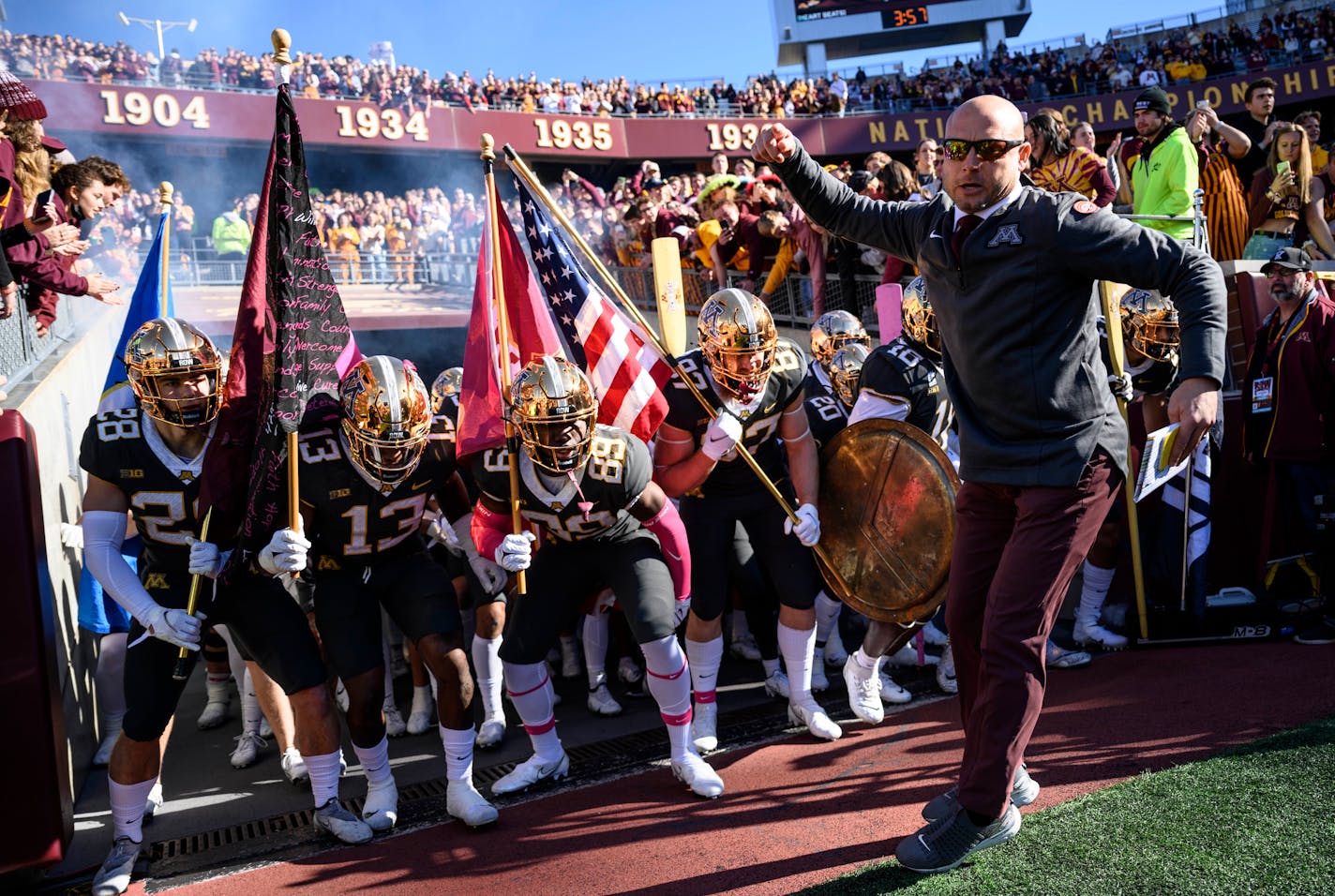 Minnesota Gophers head coach PJ Fleck leads the team onto the field before the start of a football game between the University of Minnesota Gophers and the Maryland Terrapins Saturday, Oct. 23, 2021 at Huntington Bank Stadium in Minneapolis, Minn. ] AARON LAVINSKY • aaron.lavinsky@startribune.com