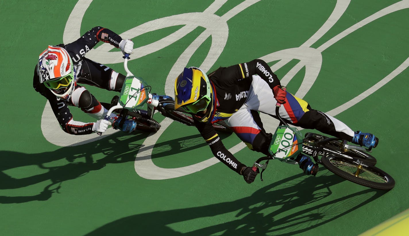 Mariana Pajon of Colombia, right, and Alise Post of the United States, left, compete to finish first and second respectively in the women's BMX cycling final during the 2016 Summer Olympics in Rio de Janeiro, Brazil, Friday, Aug. 19, 2016. (AP Photo/Victor R. Caivano)