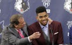 FILE - In this June 26, 2015, file photo, Minnesota Timberwolves' Karl-Anthony Towns, right, the No. 1 overall pick in the NBA draft, shares a laugh w