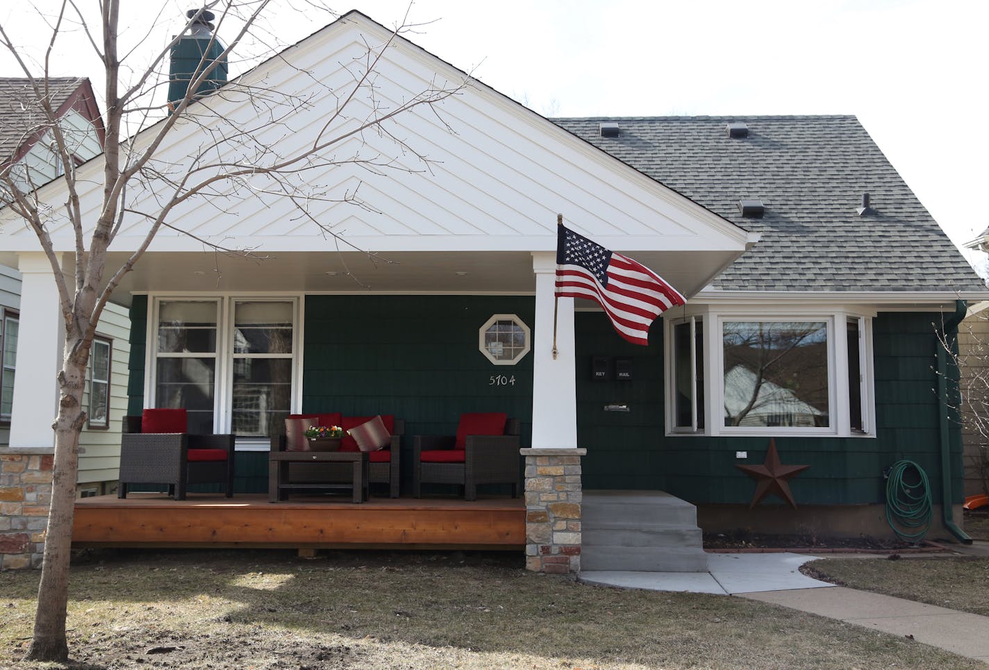 The new front porch was carefully designed by architect Ben Braun to complement the scale and character of the existing house, a 1950s rambler.