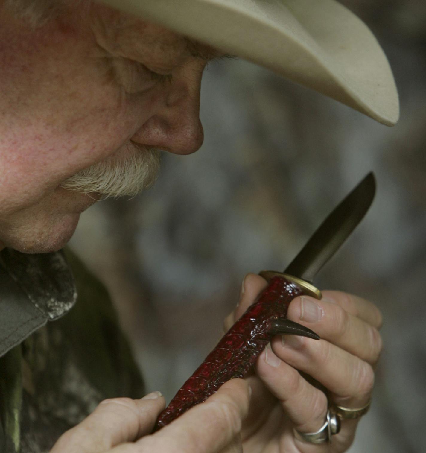 Dick Alford with a turkey knife that carries not only a sharp blade, but a long spur. ORG XMIT: MIN2016030814264024