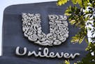 FILE - A Unilever logo is displayed outside the head office of PT Unilever Indonesia Tbk. in Tangerang, Indonesia, Tuesday, Nov. 16, 2021. Unilever, t