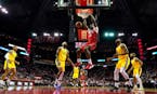 Houston Rockets' Clint Capela (15) dunks the ball as Golden State Warriors' Jordan Poole (3), Willie Cauley-Stein (2), Glenn Robinson III (22) and Ky 