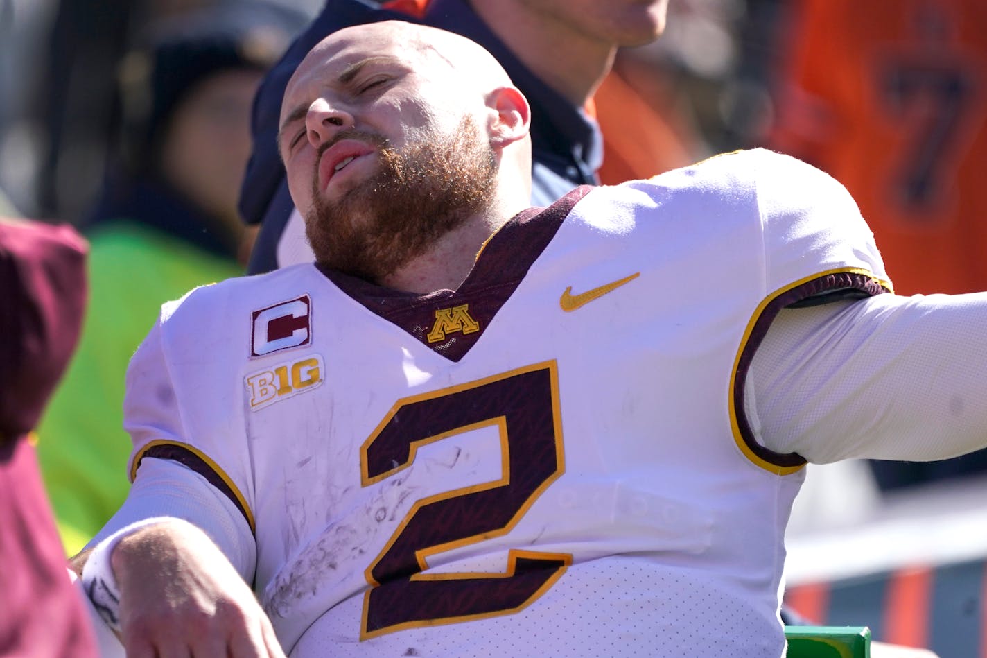 Minnesota quarterback Tanner Morgan is transported to the locker room after being injured in the second half of an NCAA college football game against Illinois, Saturday, Oct. 15, 2022, in Champaign, Ill. (AP Photo/Charles Rex Arbogast)