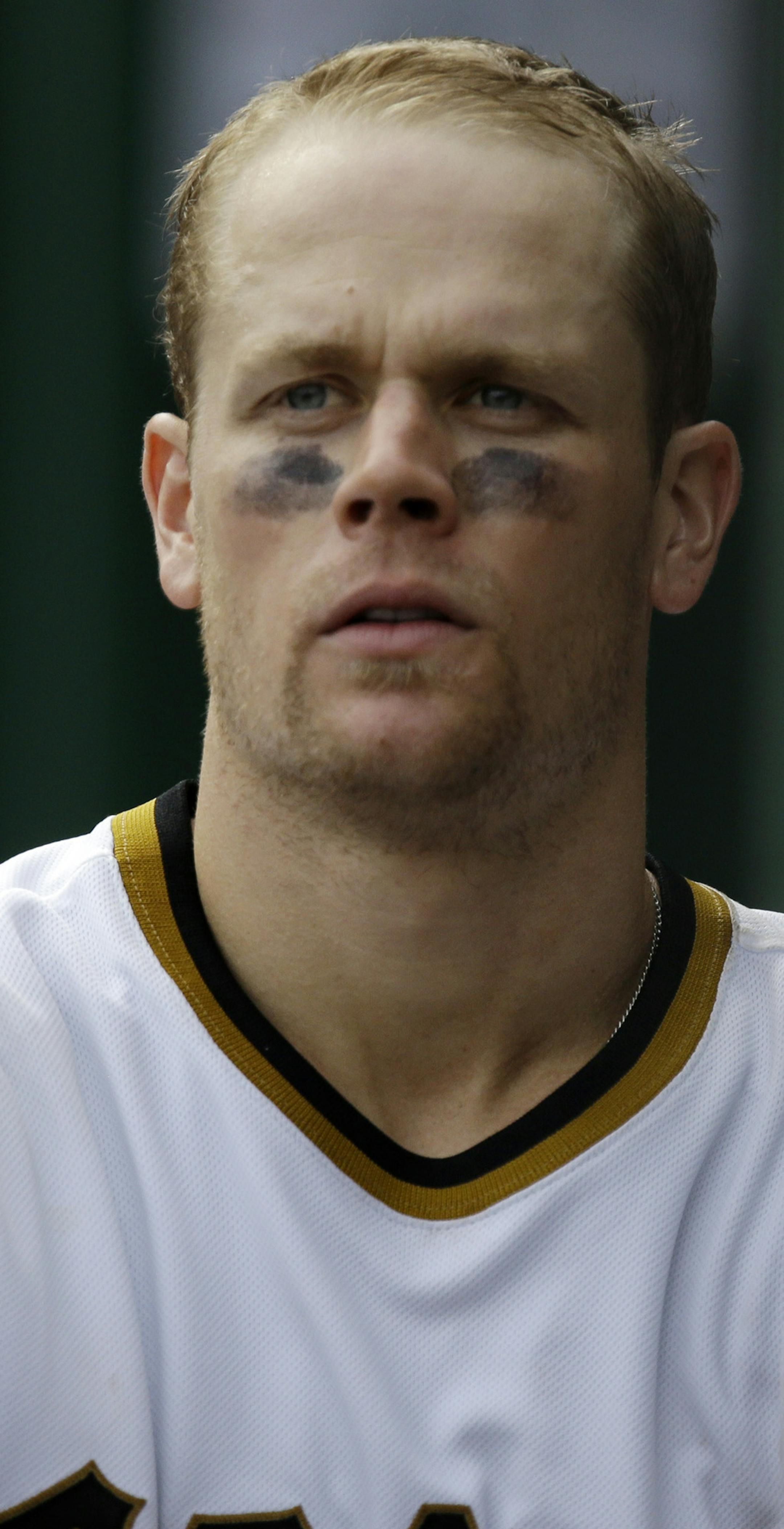 Pittsburgh Pirates Justin Morneau walks in the dugout during a baseball game against the St. Louis Cardinals in Pittsburgh Sunday, Sept. 1, 2013. The Cardinals won 7-2. (AP Photo/Gene J. Puskar) ORG XMIT: MIN2013090520192655 ORG XMIT: MIN1309052022211475