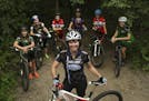 Martha Flynn, director of Crank Sisters, with a group of young women who ride for high school mountain bike teams at Theodore Wirth Park Wednesday eve