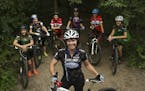 Martha Flynn, director of Crank Sisters, with a group of young women who ride for high school mountain bike teams at Theodore Wirth Park Wednesday eve