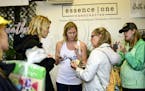 Essence One owner, Lauren VanScoy, center, helped customers at her shop at the Minnesota State Fair.