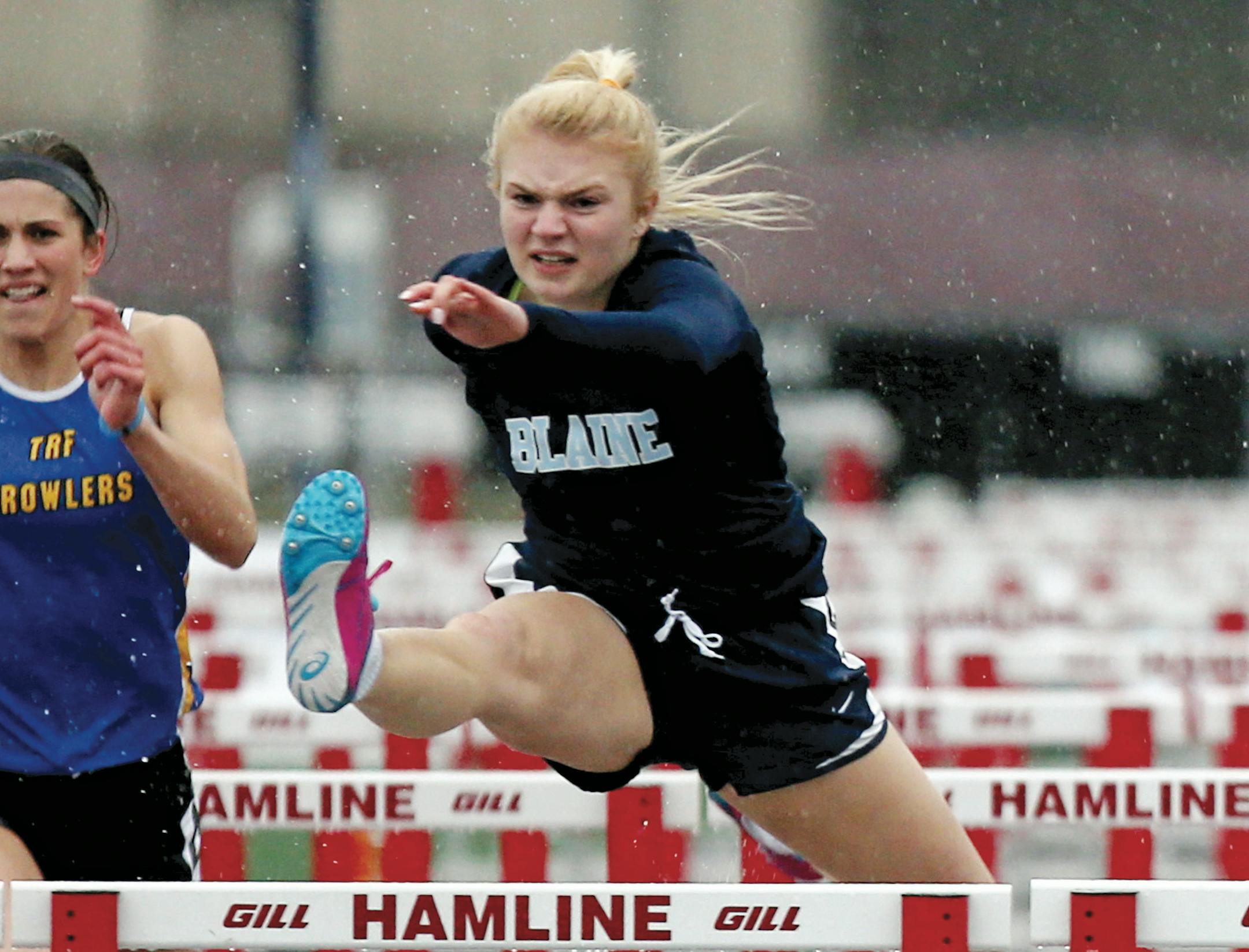 Blaine’s Alexandra Williams set a meet record in winning the 100 hurdles (14.542) at the Hamline Elite Meet on Friday night. (Kyndell Harkness/Star Tribune)