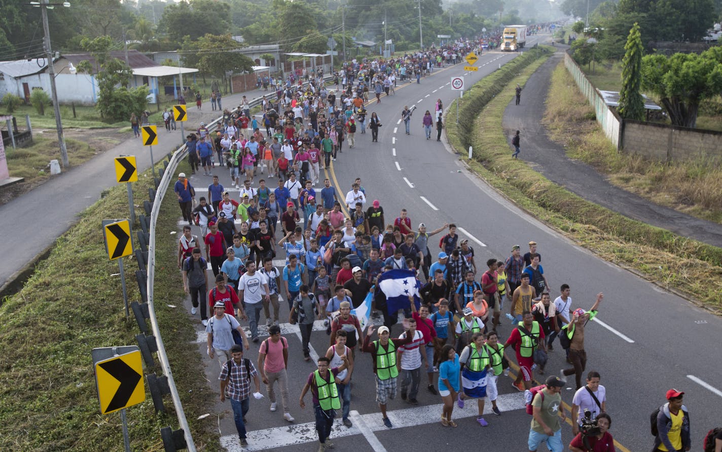 In this Oct. 21, 2018 photo, Central American migrants walking to the U.S. start their day departing Ciudad Hidalgo, Mexico. Federal immigration and health officials were blindsided by President Donald Trump&#x2019;s &#x201c;zero tolerance&#x201d; policy on migrants crossing the southwest border, triggering a cascade of problems as agencies struggled with the fallout from family separations, congressional investigators said in a critical report issued Wednesday. With the White House considering