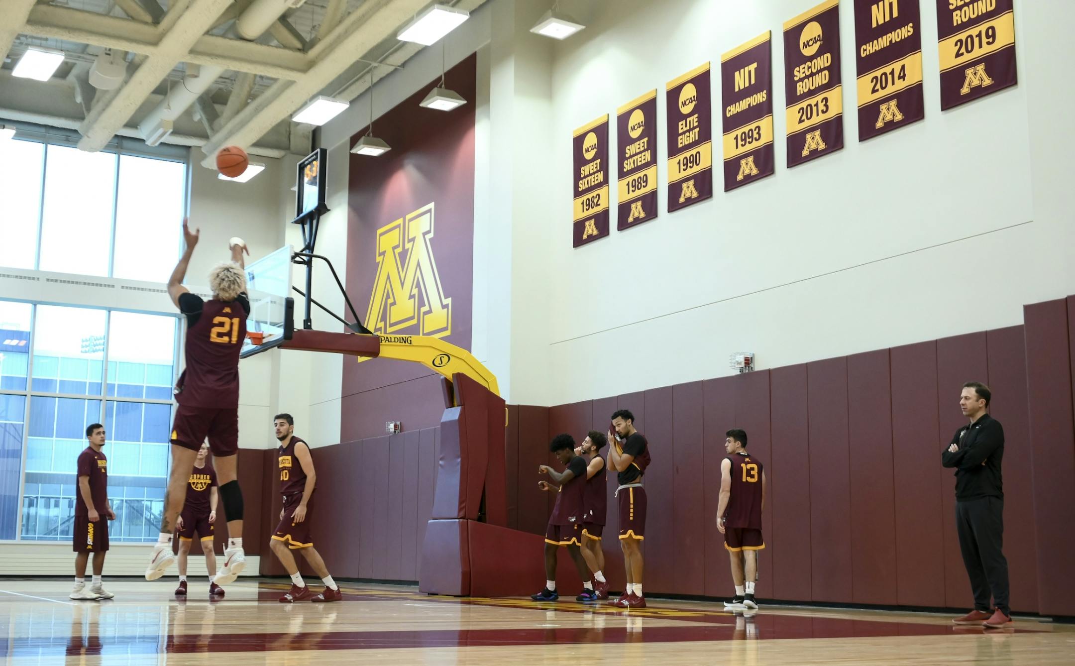 Gophers head coach Richard Pitino watched as forward Jarvis Omersa (21) attempted a shot during Tuesday's practice.