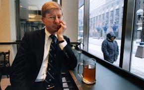 Columnist and author George F. Will sits at the counter of the Nicollet Mall (Minneapolis) Barnes & Noble bookstore having hot tea, trying to regain h