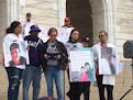 James Holt Jr. and Nicole Smith-Holt (third from right) rallied at the Minnesota state Capitol on Saturday against the high and rising prices of presc