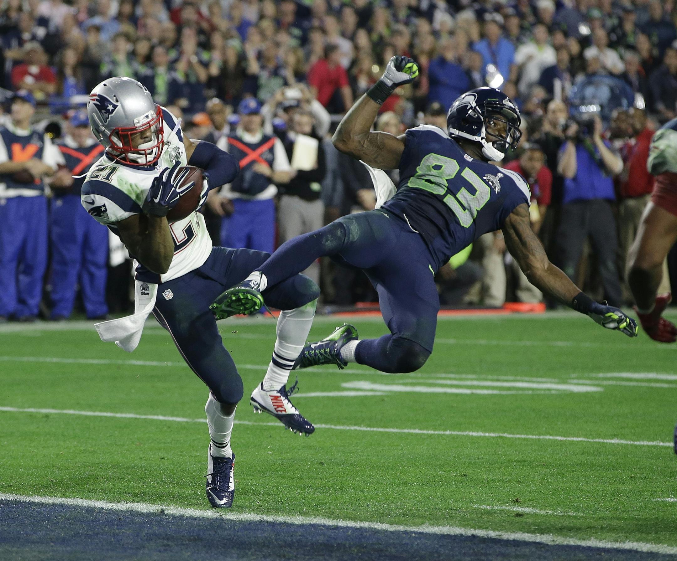 New England Patriots strong safety Malcolm Butler (21) intercepts a pass intended for Seattle Seahawks wide receiver Ricardo Lockette (83) during the second half of NFL Super Bowl XLIX football game Sunday, Feb. 1, 2015, in Glendale, Ariz. (AP Photo/Kathy Willens) ORG XMIT: MIN2015020121245509