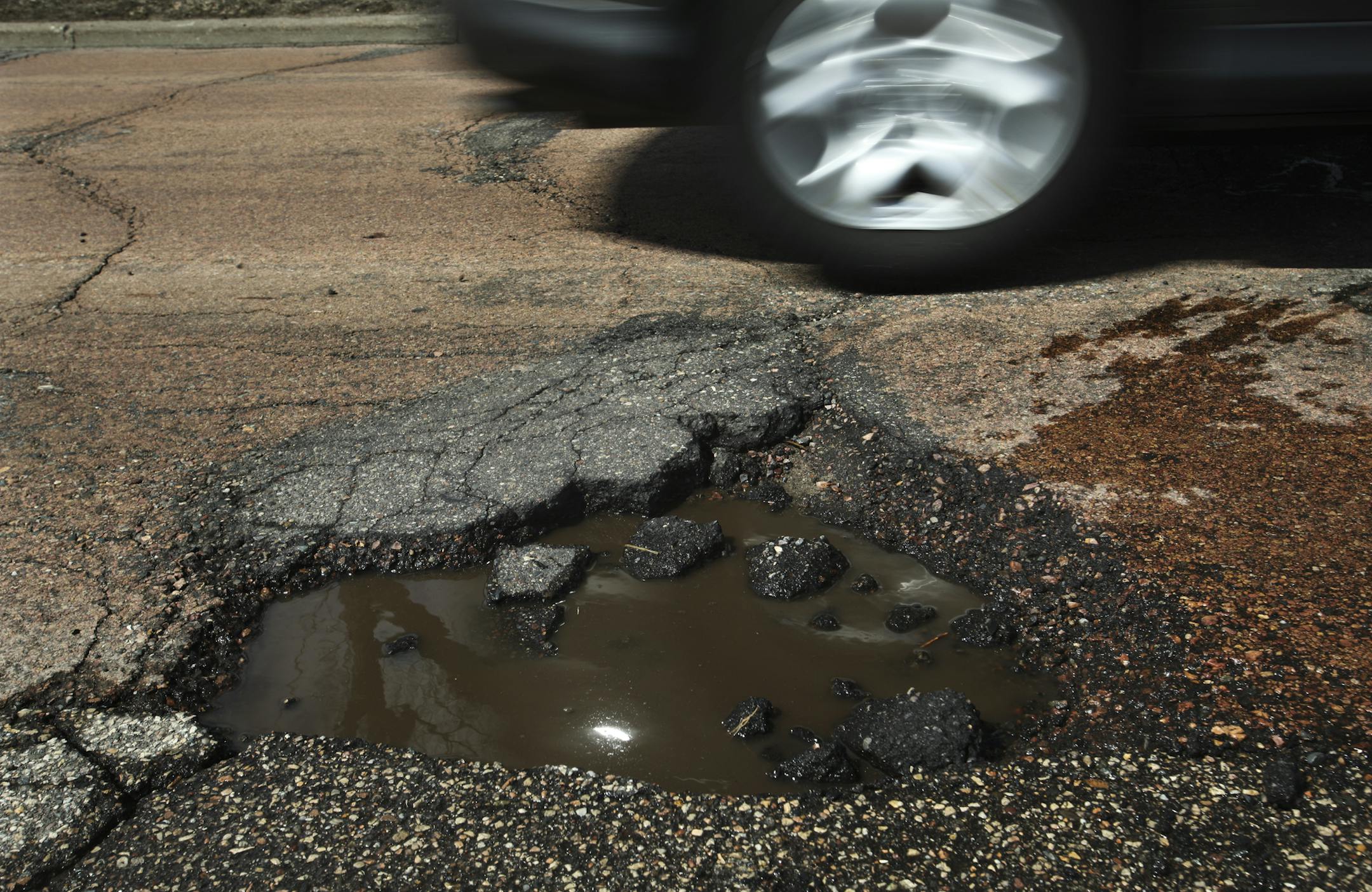 Cars driving on E. Minnehaha Parkway along Lake Nokomis tried to dodge potholes in the roadway Tuesday, April 23, 2013, in Minneapolis, MN.](DAVID JOLES/STARTRIBUNE) djoles@startribune.com On a stretch of West River Parkway, southbound drivers have been known to shift into the oncoming lane to avoid the plethora of potholes. The surface has been patched so many times that the jolting can leave a cyclist feeling scatter-brained. Help is on the way for this stretch of road, which will be closed ne