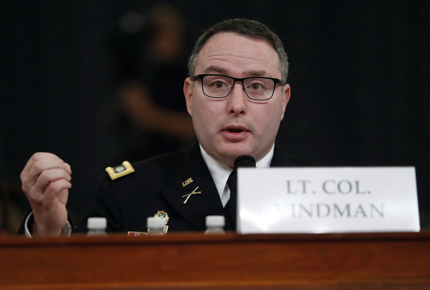 National Security Council aide Lt. Col. Alexander Vindman testifies before the House Intelligence Committee on Capitol Hill in Washington, Tuesday, Nov. 19, 2019, during a public impeachment hearing of President Donald Trump's efforts to tie U.S. aid for Ukraine to investigations of his political opponents. (AP Photo/Andrew Harnik)