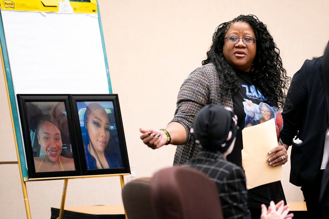 Maria Greer, Zaria McKeever’s mother, motions for her husband Paul to join her during her victim impact statement Friday at the sentencing hearing in Hennepin County court for Erick Haynes, who plotted the deadly home invasion in November 2022 that killed her 23-year-old daughter.