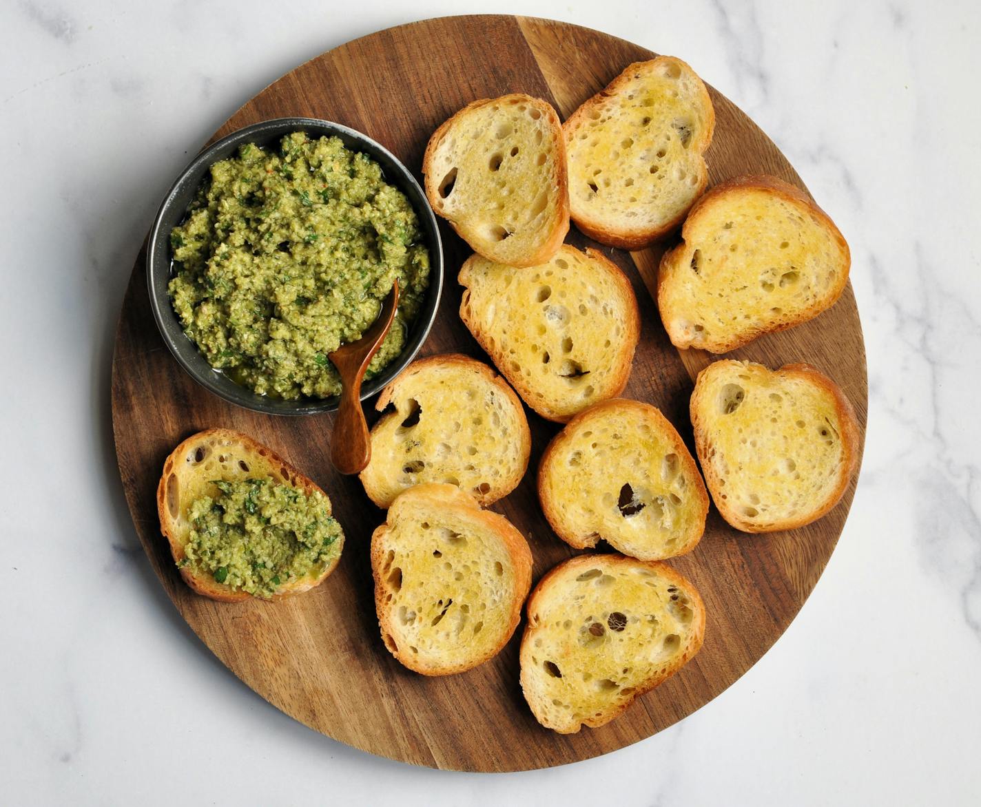 Use green olive tapenade to top crostini for a quick and flavorful appetizer. Recipe and photo by Meredith Deeds, Special to the Star Tribune