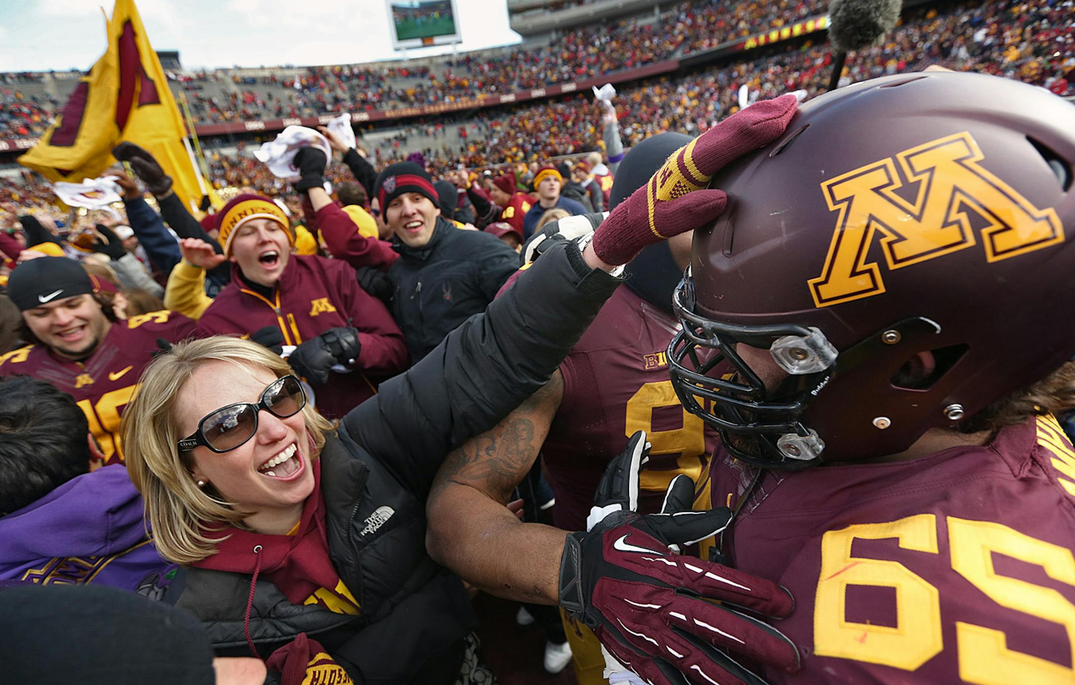 Josh Campion and other Gophers players were greeted by enthusiastic fans after upsetting Nebraska 34-23 at TCF Bank Stadium.
