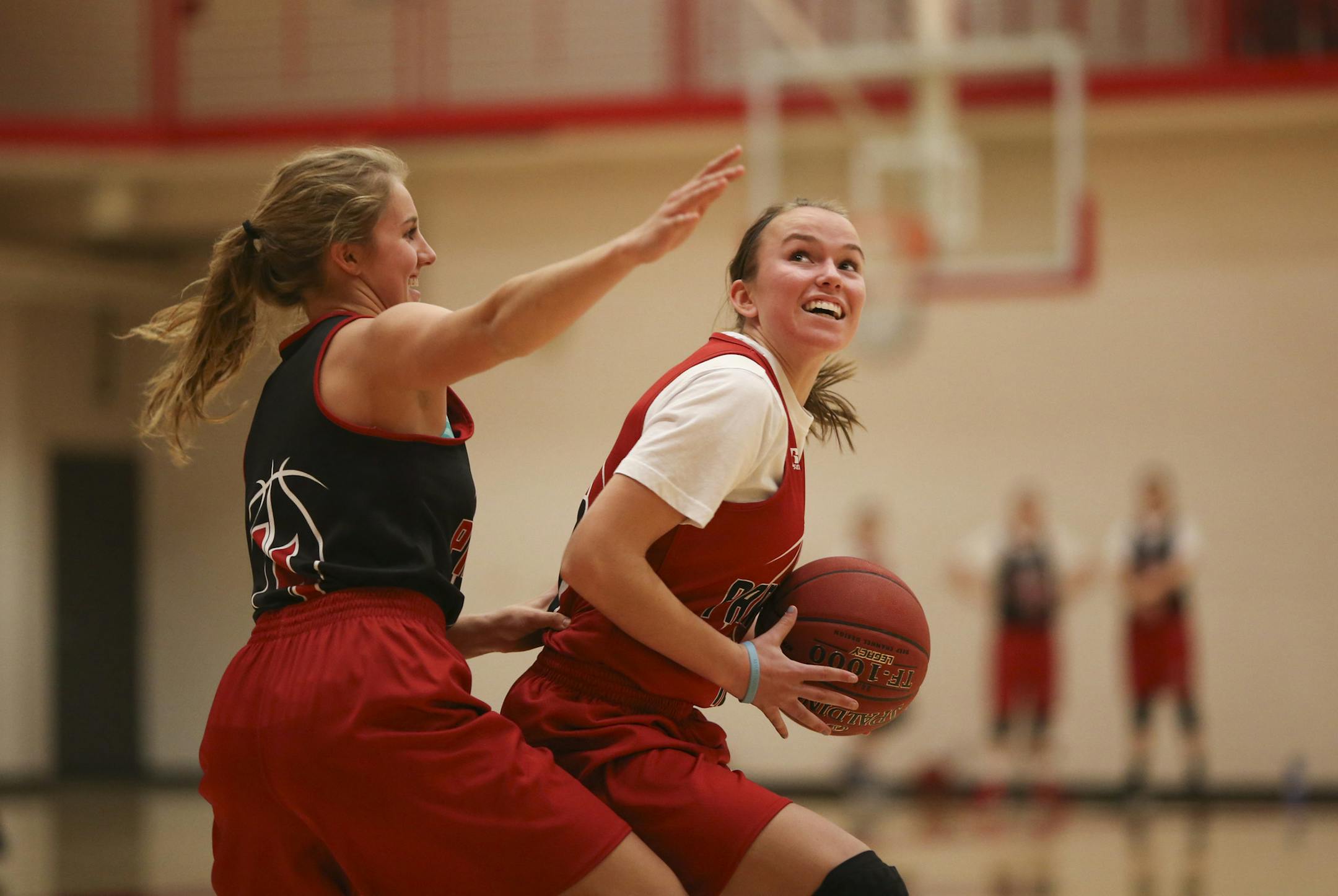 Temi Carda, left, guarded Polly Sjoberg as they worked out during practice Monday afternoon at Lakeville North High School. ] JEFF WHEELER ‚Ä¢ jeff.wheeler@startribune.com The Lakeville North girl's basketball team practiced Monday afternoon, December 22, 2014 at the high school.