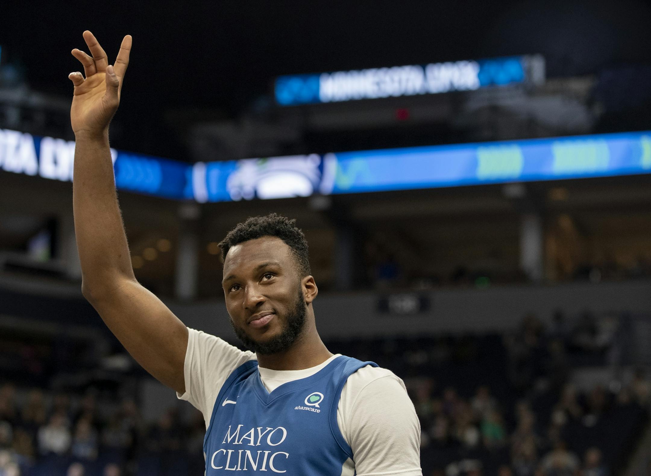 Minnesota Timberwolves Josh Okogie waved to the crowd during the Lynx game on Wednesday.