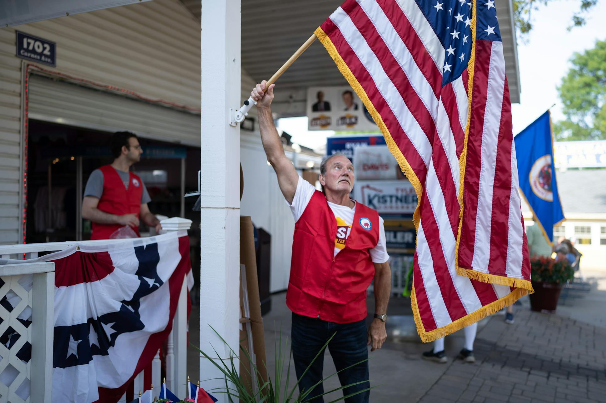 On the morning of Aug. 26, Radja Lohse, a volunteer at the Republican booth at the State Fair, placed the American flag in its holder and said, “There, now we are open!”