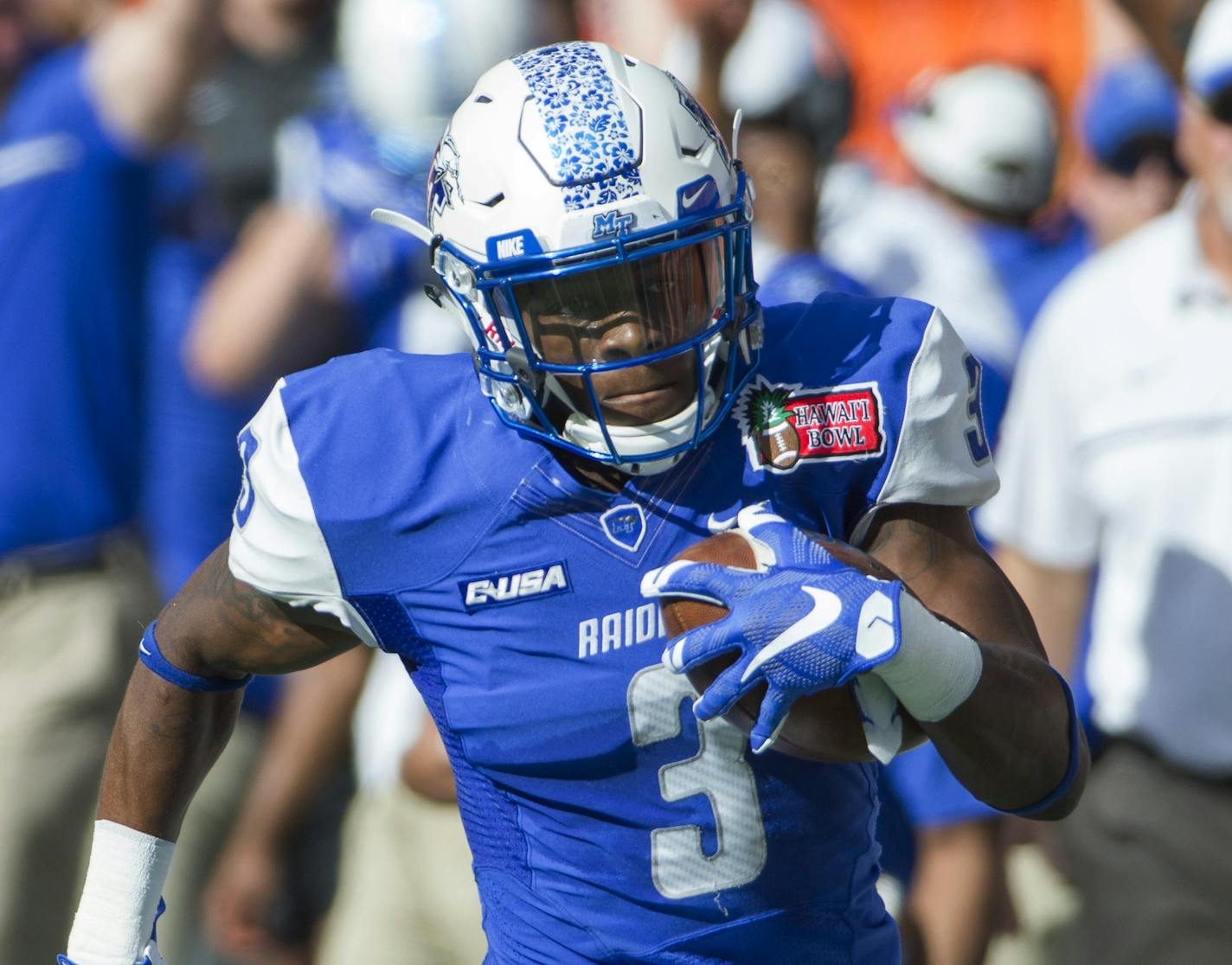 Middle Tennessee wide receiver Richie James (3) runs after catching a pass against Hawaii during the first quarter of the Hawaii Bowl NCAA college football game Saturday, Dec. 24, 2016, in Honolulu. James scored a touchdown on the play. (AP Photo/Eugene Tanner) ORG XMIT: HIET107