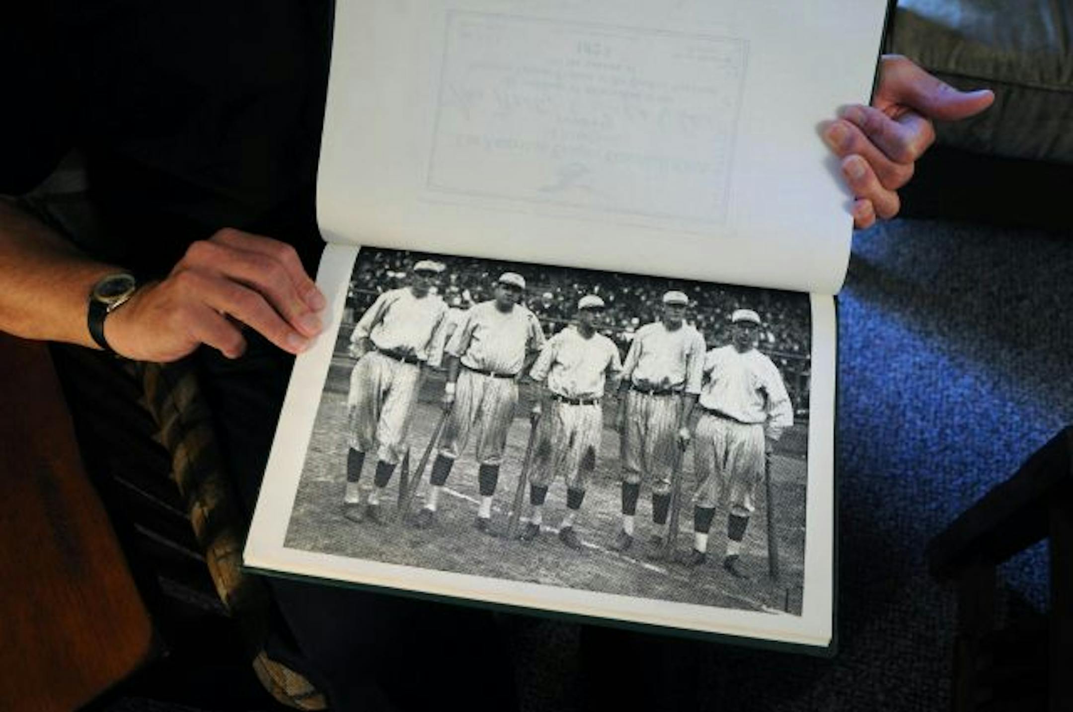 The Rev.Tom Pipp holds a photo of his grandfather, Wally Pipp, far left, the New York Yankees first baseman who was replaced by a youngster named Lou Gehrig. Babe Ruth is second from the left in the photo.