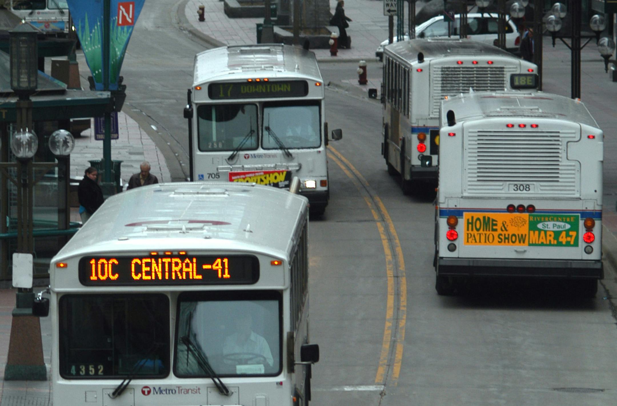 The MTC buses were making the rounds on Nicollet Ave in downtown Minneapolis GENERAL INFORMATION: Minneapolis,MN. Monday 4/19/2004 The first buses began to roll out of the Nicollet Garage around 3:45 AM ORG XMIT: MIN2014082913581234 ORG XMIT: MIN1408291400510190