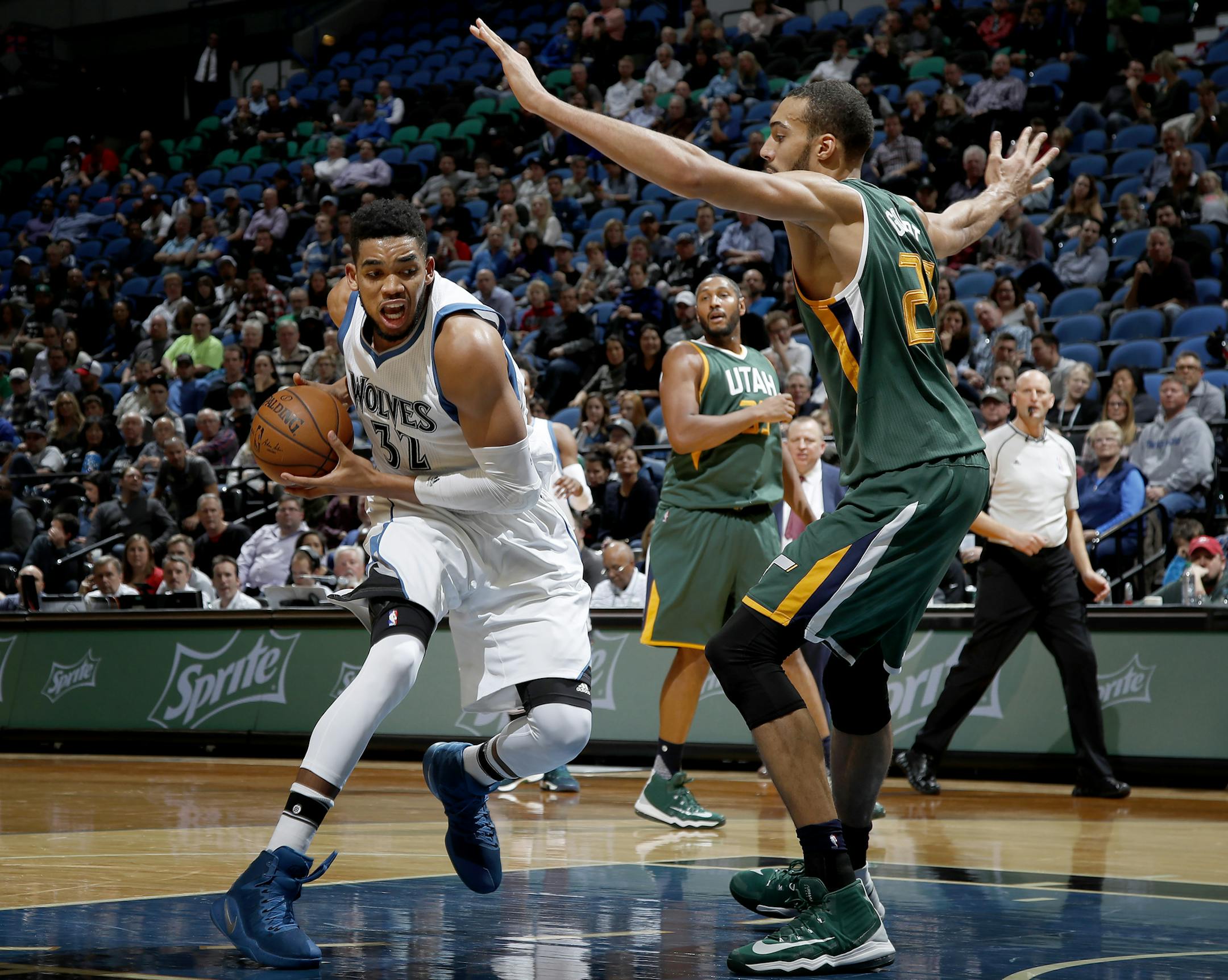 Karl-Anthony Towns (32) was defended by Rudy Gobert (27) in the third quarter. ] CARLOS GONZALEZ cgonzalez@startribune.com - November 28, 2016, Minneapolis, MN, Target Center, NBA, Minnesota Timberwolves vs. Utah Jazz