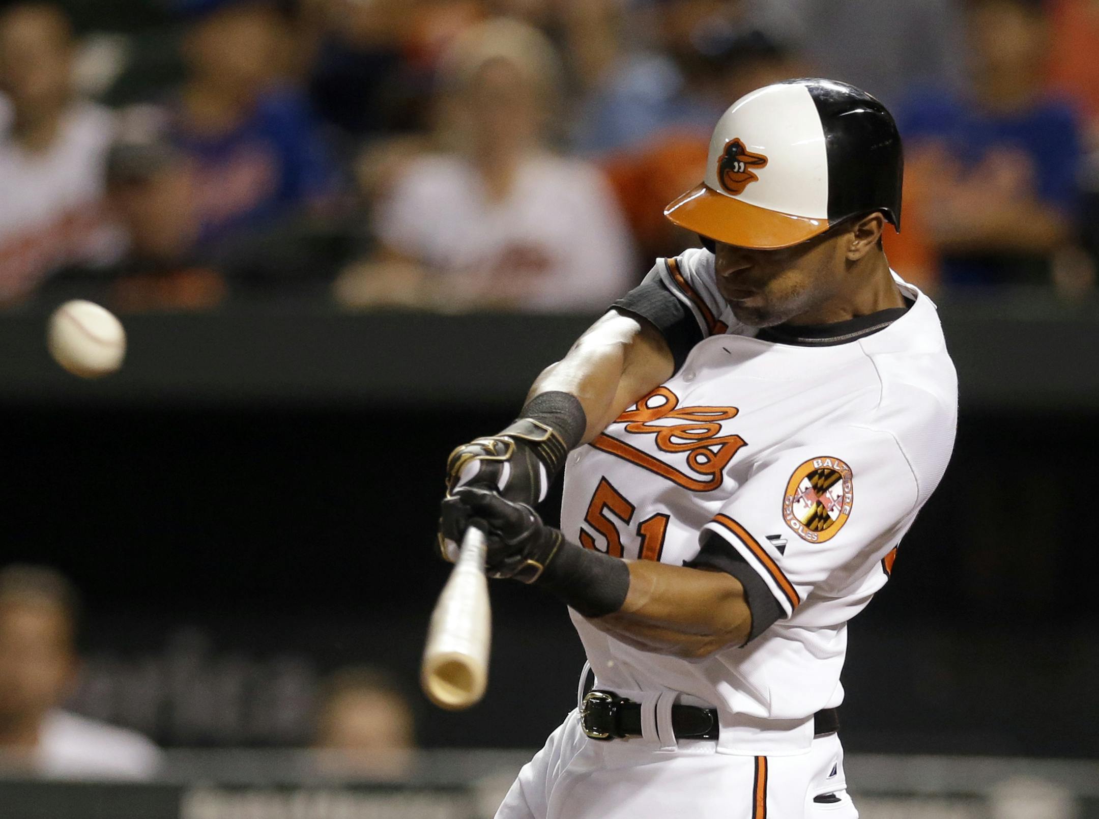 Baltimore Orioles' Henry Urrutia hits a solo home run during the ninth inning of a baseball game against the New York Mets, Wednesday, Aug. 19, 2015, in Baltimore. Baltimore won 5-4. (AP Photo/Patrick Semansky)