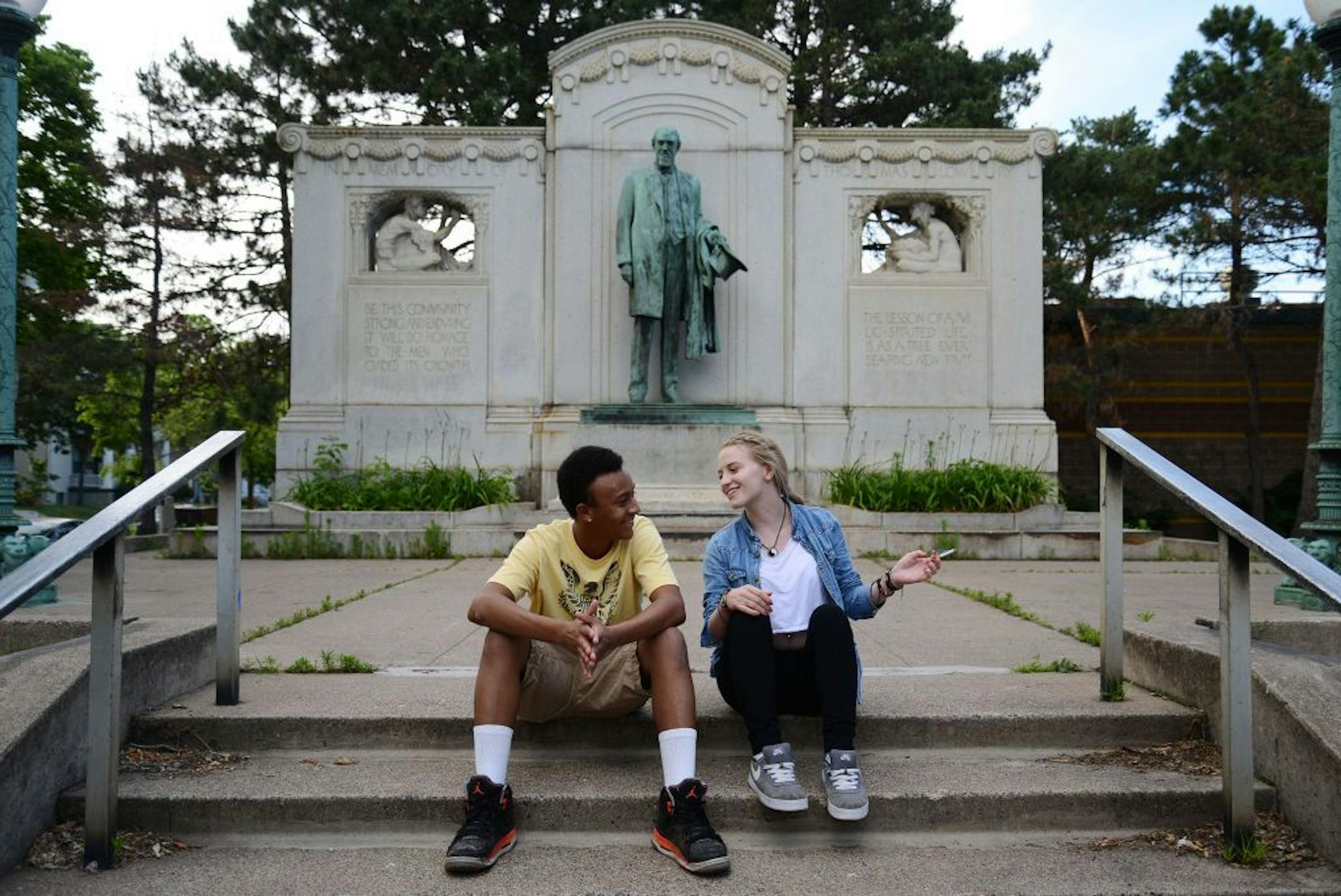 From left, Anthony Stewart, of Bloomington, and Nikki Kettles, of Minneapolis, talked in front of the Thomas Lowry statue on Hennepin Av in Minneapolis, Minn., on Saturday June 27, 2015.